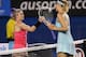 Bethanie Mattek-Sands and Maria Sharapova at the end of their Australian Open match.