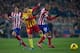 MADRID, SPAIN - JANUARY 11: Joao Miranda (R) of Atletico de Madrid steals the ball from Lionel Messi (2nd R) of FC Barcelona as Tiago Mendes (L) looks on during the La Liga match between Club Atletico de Madrid and FC Barcelona at Vicente Calderon Stadium