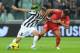 TURIN, ITALY - OCTOBER 30: Claudio Marchisio (L) of Juventus is challenged by Gonzalo Bergessio of Calcio Catania during the Serie A match between Juventus and Catania Calcio at Juventus Arena on October 30, 2013 in Turin, Italy. (Photo by Valerio Penni