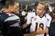 Oct 7, 2012; Foxborough, MA, USA; New England Patriots quarterback Tom Brady (12) shakes hands with Denver Broncos quarterback Peyton Manning (18) following the game at Gillette Stadium. The Patriots defeated the Broncos 31-21. Mandatory Credit: Stew Miln