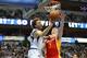 DALLAS, TX - NOVEMBER 20: (L-R) Dirk Nowitzki #41 of the Dallas Mavericks makes a pass in front of Omer Asik #3 of the Houston Rockets at American Airlines Center on November 20, 2013 in Dallas, Texas. NOTE TO USER: User expressly acknowledges and agre