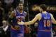 Jan 2, 2014; San Antonio, TX, USA; New York Knicks guard Iman Shumpert (21) celebrates a score with Beno Udrih (18) during the second half against the San Antonio Spurs at AT&T Center. The Knicks won 105-101. Mandatory Credit: Soobum Im-USA TODAY Sports