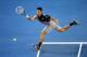 MELBOURNE, AUSTRALIA - JANUARY 13: Novak Djokovic of Serbia plays a forehand in his first round match against Lukas Lacko of Slovakia during day one of the 2014 Australian Open at Melbourne Park on January 13, 2014 in Melbourne, Australia. (Photo by Cli