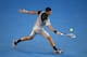 MELBOURNE, AUSTRALIA - JANUARY 13: Novak Djokovic of Serbia plays a backhand in his first round match against Lukas Lacko of Slovakia during day one of the 2014 Australian Open at Melbourne Park on January 13, 2014 in Melbourne, Australia. (Photo by Cli