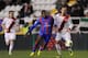 MADRID, SPAIN - JANUARY 09: Aloys Nong (L) of Levante UD battles for the ball against Alejandro Galvez of Rayo Vallecano de Madrid during the Copa del Rey Round of 16, 1st Leg match between Rayo Vallecano and Levante UD at Campo de Futbol de Vallecas st