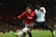 MANCHESTER, ENGLAND - JANUARY 01: Emmanuel Adebayor of Tottenham Hotspur battles for the ball with Wayne Rooney of Manchester United during the Barclays Premier League match between Manchester United and Tottenham Hotspur at Old Trafford on January 1, 20