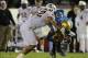 Nov 23, 2013; Pasadena, CA, USA; Arizona State Sun Devils linebacker Carl Bradford (52) stops UCLA Bruins linebacker Anthony Barr (11) after recovering a fumbled punt in the second half of the game at the Rose Bowl. Arizona State Sun Devils won 38-3