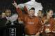 PASADENA, CA - JANUARY 04: Head coach Mack Brown of the Texas Longhorns celebrates with the National Championship trophy after defeating the USC Trojans 41-38 to win the BCS National Championship Rose Bowl Game on January 4, 2006 in Pasadena, California.