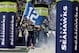 SEATTLE, WA - JANUARY 11: Linebacker Heath Farwell #55 of the Seattle Seahawks runs out of the tunnel with the 12th Man flag before taking on the New Orleans Saints during the NFC Divisional Playoff Game at CenturyLink Field on January 11, 2014 in Seattl