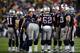FOXBORO, MA - JANUARY 11: Head coach Bill Belichick of the New England Patriots talks with his team during a break in play in the AFC Divisional Playoff game against the Indianapolis Colts at Gillette Stadium on January 11, 2014 in Foxboro, Massachusetts