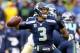 SEATTLE, WA - JANUARY 11: Quarterback Russell Wilson #3 of the Seattle Seahawks looks to pass the ball against the New Orleans Saints in the second quarter during the NFC Divisional Playoff Game at CenturyLink Field on January 11, 2014 in Seattle, Washin