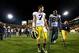 Dec 28, 2013; Tempe, AZ, USA; Michigan Wolverines quarterback Shane Morris (7) walks off the field with injured quarterback Devin Gardner (98) following the game against the Kansas State Wildcats during the Buffalo Wild Wings Bowl at Sun Devil Stadium. K