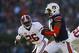 AUBURN, AL - NOVEMBER 30: Nick Marshall #14 of the Auburn Tigers runs the ball against the defense of Landon Collins #26 of the Alabama Crimson Tide in the first half at Jordan-Hare Stadium on November 30, 2013 in Auburn, Alabama. (Photo by Kevin C. Cox