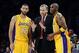 Jan 14, 2014; Los Angeles, CA, USA; Los Angeles Lakers head coach Mike D'Antoni talks to point guard Kendall Marshall (12) and shooting guard Jodie Meeks (20) in the second half of the game against the Cleveland Cavaliers at Staples Center. Cleveland Cava