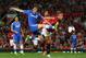 MANCHESTER, ENGLAND - AUGUST 26: Oscar of Chelsea is challenged by Nemanja Vidic of Manchester United during the Barclays Premier League match between Manchester United and Chelsea at Old Trafford on August 26, 2013 in Manchester, England. (Photo by Al