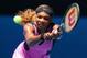 MELBOURNE, AUSTRALIA - JANUARY 15: Serena Williams of the United States plays a backhand in her second round match against Vesna Dolonc of Serbia during day three of the 2014 Australian Open at Melbourne Park on January 15, 2014 in Melbourne, Australia.