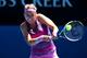 MELBOURNE, AUSTRALIA - JANUARY 14: Victoria Azarenka of Belarus plays a backhand in her first round match against Johanna Larsson of Sweden during day two of the 2014 Australian Open at Melbourne Park on January 14, 2014 in Melbourne, Australia. (Photo