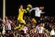 LONDON, ENGLAND - JANUARY 11: Dimitar Berbatov (R) of Fulham challenges Vito Mannone the Sunderland goalkeeper during the Barclays Premier League match between Fulham and Sunderland at Craven Cottage on January 11, 2014 in London, England. (Photo by Jam