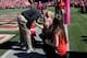 SAN FRANCISCO, CA - OCTOBER 13: Head coach Jim Harbaugh of the San Francisco 49ers kisses his wife Sarah Feuerborn Harbaugh before their game against the Arizona Cardinals at Candlestick Park on October 13, 2013 in San Francisco, California. (Photo by E