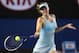 MELBOURNE, AUSTRALIA - JANUARY 14: Maria Sharapova of Russia plays a forehand in her first round match against Bethanie Mattek-Sands of the United States during day two of the 2014 Australian Open at Melbourne Park on January 14, 2014 in Melbourne, Austr