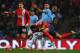 MANCHESTER, ENGLAND - JANUARY 15: Fernandinho of Manchester City tangles with Lee Williamson of Blackburn Rovers during the Budweiser FA Cup Third Round Replay match between Manchester City and Blackburn Rovers at the Etihad Stadium on January 15, 2014 i