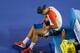 MELBOURNE, AUSTRALIA - JANUARY 14: Bernard Tomic of Australia removes strapping from his leg in his first round match against Rafael Nadal of Spain during day two of the 2014 Australian Open at Melbourne Park on January 14, 2014 in Melbourne, Australia.