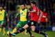 NORWICH, ENGLAND - DECEMBER 28: Nathan Redmond of Norwich City battles with Michael Carrick of Manchester United during the Barclays Premier League match between Norwich City and Manchester United at Carrow Road on December 28, 2013 in Norwich, England.