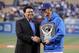 LOS ANGELES, CA - APRIL 11: Pitcher Clayton Kershaw (R) #22 of the Los Angeles Dodgers is presented the National League Cy Young Award plaque by former Dodger pitcher Fernando Valenzuela prior to the start of the game against the Pittsburgh Pirates at Do