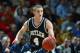 BIRMINGHAM, AL - MARCH 21: Brandon Miller #4 of the Butler University Bulldogs drives against the Mississippi State University Bulldogs during the NCAA Tournament at the Birmingham Civic Center on March 21, 2003 in Birmingham, Alabama. Butler defeated M