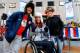 NEW YORK, NY - OCTOBER 29: Snowboarding Olympic athlete Louie Vito and Paralympic Alpine Skiing Olympic athlete Alana Nichols poses with an fan during the 100 Days Out Sochi Winter Olympics Event at NBC's TODAY Show on October 29, 2013 in New York City.