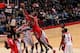 WASHINGTON, DC - JANUARY 11: Dwight Howard #12 of the Houston Rockets shoots against Marcin Gortat #4 of the Washington Wizards during the game at the Verizon Center on January 11, 2014 in Washington, DC. NOTE TO USER: User expressly acknowledges and agre