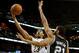 Jan 13, 2014; New Orleans, LA, USA; New Orleans Pelicans power forward Anthony Davis (23) shoots over San Antonio Spurs power forward Tim Duncan (21) during the second half of a game at the New Orleans Arena. The Spurs defeated the Pelicans 101-95. Manda