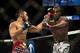 Jan 15, 2014; Duluth, GA, USA; Lorenz Larkin (red gloves) fights Brad Tavares (blue gloves) during UFC Fight Night at Gwinnett Center. Mandatory Credit: Joshua S. Kelly-USA TODAY Sports