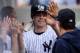 NEW YORK, NY - SEPTEMBER 21: Mark Reynolds #39 of the New York Yankees is congratulated by teammates after scoring a run in the third inning against the San Francisco Giants during interleague play on September 21, 2013 at Yankee Stadium in the Bronx bor