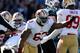 CHARLOTTE, NC - JANUARY 12: Tony Jerod-Eddie #63 of the San Francisco 49ers celebrates after a defensive stop near the goal line against the Carolina Panthers in the second quarter during the NFC Divisional Playoff Game at Bank of America Stadium on Janua