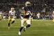PITTSBURGH, PA - NOVEMBER 09: Devin Street #15 of the Pittsburgh Panthers breaks a tackle and scores a 63 yard touchdown in the second half against the Notre Dame Fighting Irish during the game on November 9, 2013 at Heinz Field in Pittsburgh, Pennsylvan