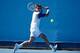 MELBOURNE, AUSTRALIA - JANUARY 13: Tommy Robredo of Spain plays a backhand in his first round match against Lukas Rosol of the Czech Republic during day one of the 2014 Australian Open at Melbourne Park on January 13, 2014 in Melbourne, Australia. (Phot
