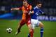 GELSENKIRCHEN, GERMANY - MARCH 12: Semih Kaya of Galatasaray challenges Julian Draxler of Schalke during the UEFA Champions League round of 16 second leg match between FC Schalke 04 and Galatasaray AS at Veltins-Arena on March 12, 2013 in Gelsenkirchen, G