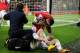 LONDON, ENGLAND - JANUARY 01: An injured Nicklas Bendtner of Arsenal is congratulated by team mate Theo Walcott (R) as he scores their first goal during the Barclays Premier League match between Arsenal and Cardiff City at Emirates Stadium on January 1,