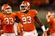 CLEMSON, SC - NOVEMBER 14: Teammates Corey Crawford #93 and Spencer Shuey #33 of the Clemson Tigers celebrate after a defensive stop during their game against the Georgia Tech Yellow Jackets at Clemson Memorial Stadium on November 14, 2013 in Clemson, So