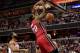 WASHINGTON, DC - JANUARY 15: Greg Oden #20 of the Miami Heat dunks the ball against the Washington Wizards during the first half at Verizon Center on January 15, 2014 in Washington, DC. NOTE TO USER: User expressly acknowledges and agrees that, by downloa