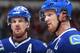 VANCOUVER, BC - DECEMBER 30: Henrik Sedin #33 and Daniel Sedin #22 of the Vancouver Canucks talk during their NHL game against the Philadelphia Flyers at Rogers Arena December 30, 2013 in Vancouver, British Columbia, Canada. Philadelphia won 4-3 in a sh