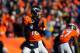 DENVER, CO - JANUARY 12: Peyton Manning #18 of the Denver Broncos looks to pass against the San Diego Chargers during the AFC Divisional Playoff Game at Sports Authority Field at Mile High on January 12, 2014 in Denver, Colorado. (Photo by Justin Edmond