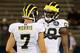 EAST HARTFORD, CT - SEPTEMBER 21: Devin Gardner #98 and Shane Morris #7 of the Michigan Wolverines talk before a game with Connecticut Huskies at Rentschler Field on September 21, 2013 in East Hartford, Connecticut. (Photo by Jim Rogash/Getty Images)