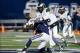 Nov 23, 2013; Logan, UT, USA; Utah State Aggies quarterback Darell Garretson (6) is sacked by Colorado State Rams linebacker Shaquil Barrett (56) during the first quarter at Romney Stadium. Mandatory Credit: Chris Nicoll-USA TODAY Sports