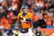DENVER, CO - JANUARY 12: Peyton Manning #18 of the Denver Broncos looks to pass during the AFC Divisional Playoff Game against the San Diego Chargers at Sports Authority Field at Mile High on January 12, 2014 in Denver, Colorado. (Photo by Christian Pet