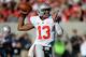 BERKELEY, CA - SEPTEMBER 14: Kenny Guiton #13 of the Ohio State Buckeyes rolls out to pass during the second quarter against the California Golden Bears at California Memorial Stadium on September 14, 2013 in Berkeley, California. (Photo by Thearon W. H