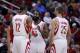Jan 16, 2014; Houston, TX, USA; Houston Rockets shooting guard James Harden (13) speaks with power forward Dwight Howard (12) and small forward Chandler Parsons (25) during the first quarter against the Oklahoma City Thunder at Toyota Center. Mandatory Cr