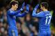 LONDON, ENGLAND - FEBRUARY 09: Eden Hazard of Chelsea is congratulated on the second goal by Oscar during the Barclays Premier League match between Chelsea and Wigan Athletic at Stamford Bridge on February 9, 2013 in London, England. (Photo by Laurence