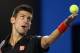 MELBOURNE, AUSTRALIA - JANUARY 17: Novak Djokovic of Serbia tosses the ball up to serve in his third round match against Denis Istomin of Uzbekistan during day five of the 2014 Australian Open at Melbourne Park on January 17, 2014 in Melbourne, Australia